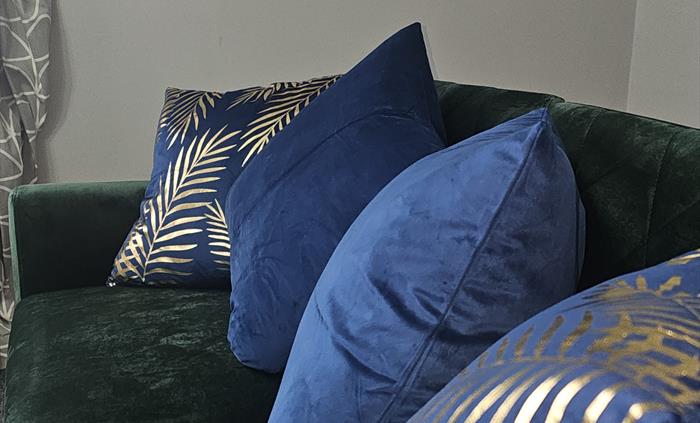 The Redford Cwtch Lounge – a cosy, welcoming space with soft seating, warm lighting, and rustic charm, perfect for relaxing with family or friends aft